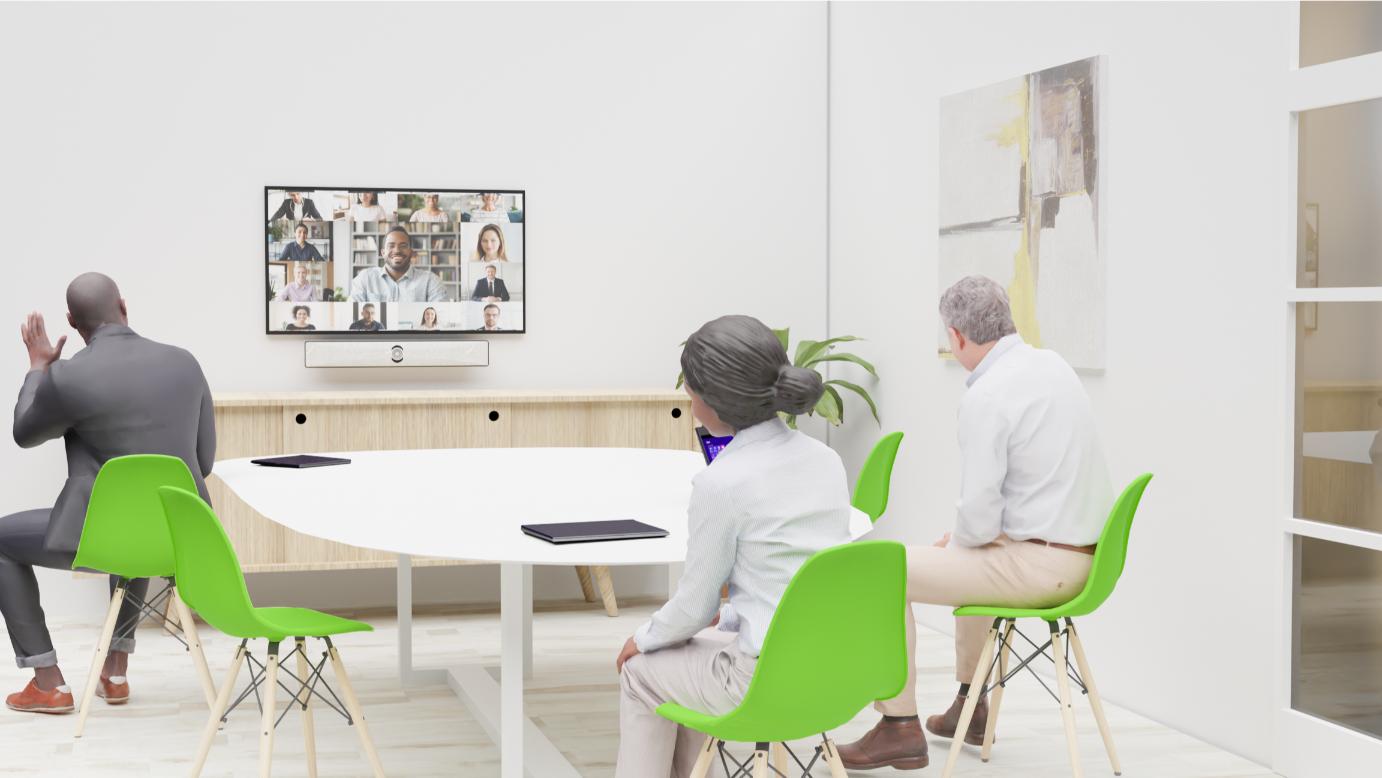 A diverse group in a modern conference room watches a video call on a screen, surrounded by minimalistic art and green chairs.